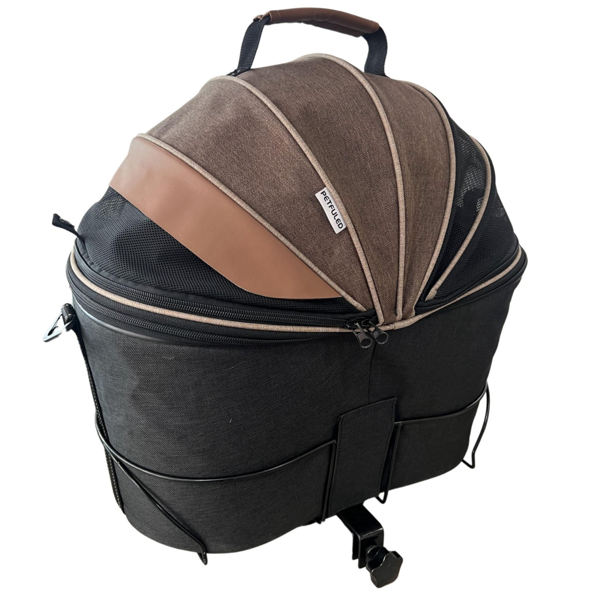 Canvas pet carrier showing the folding shade canopy over the mesh top
