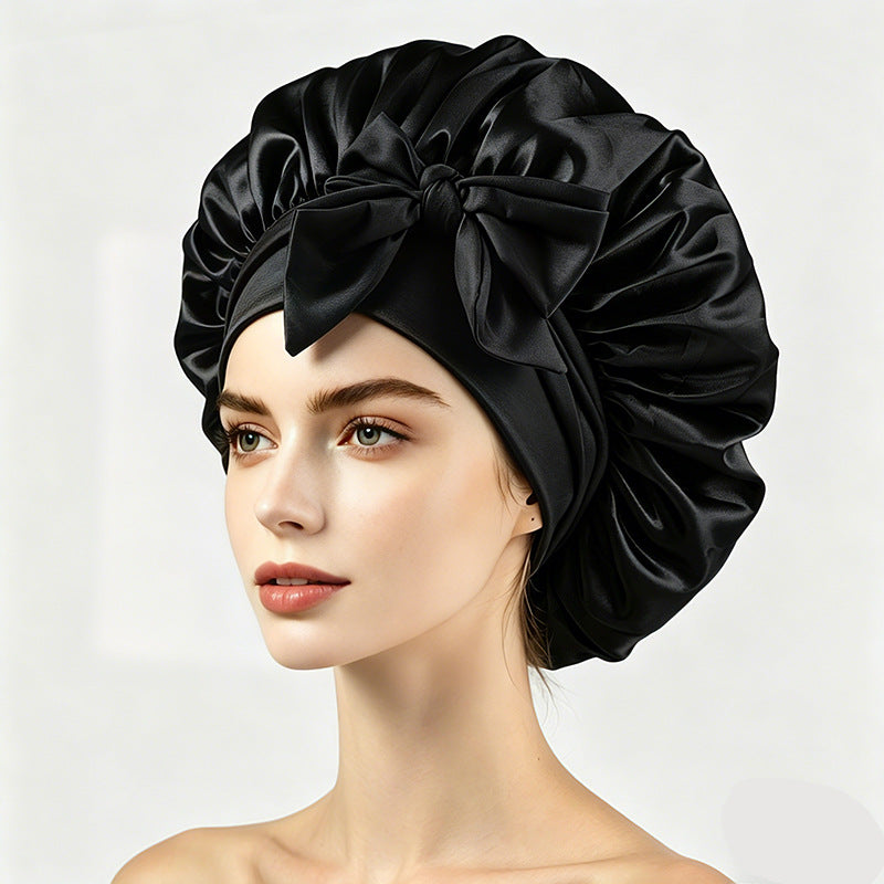 Satin hair wrap bonnet with a wide band and bow, shown as a colour option