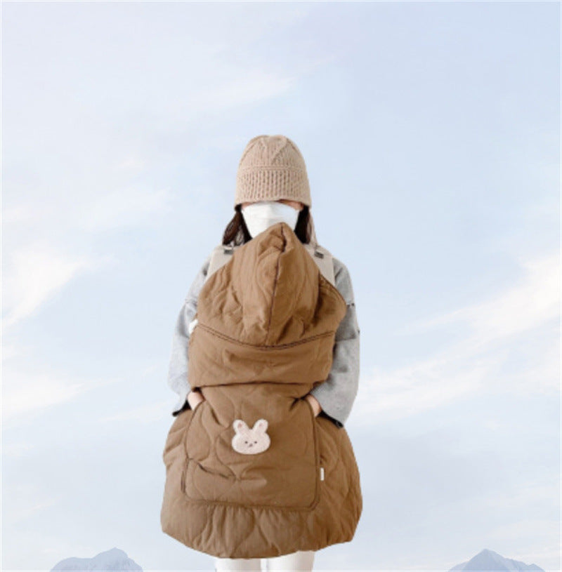 Soft fleece lining shown inside the quilted windproof baby cape