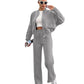 Womens fleece zip jacket and wide-leg pants set worn by a model, side view