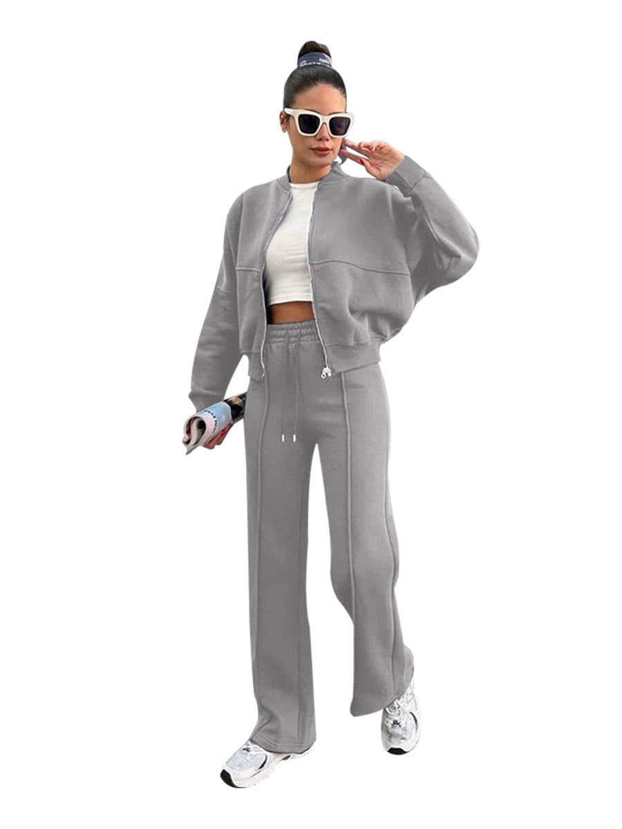Womens fleece zip jacket and wide-leg pants set worn by a model, side view