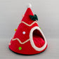 Christmas tree shaped warm pet den on a plain background