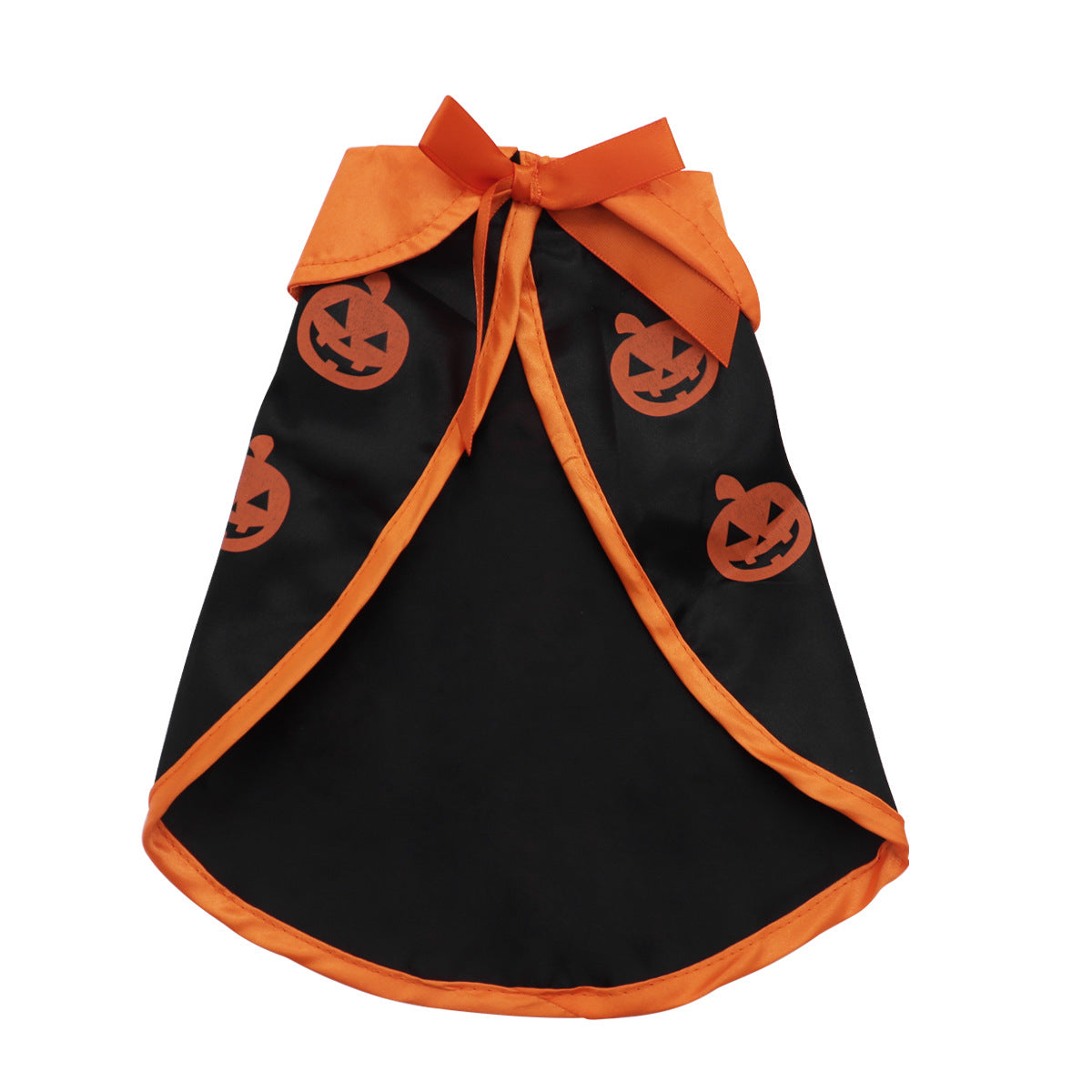 Small white dog wearing a black pumpkin print Halloween cape and a bell topped witch hat
