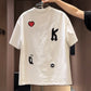 Men's loose fit embroidered patch T-shirt in white with a varsity A letter and sewn on patches