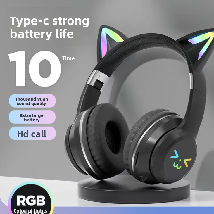 Black cat ear headphones on a stand seen from the side with lit ear tips
