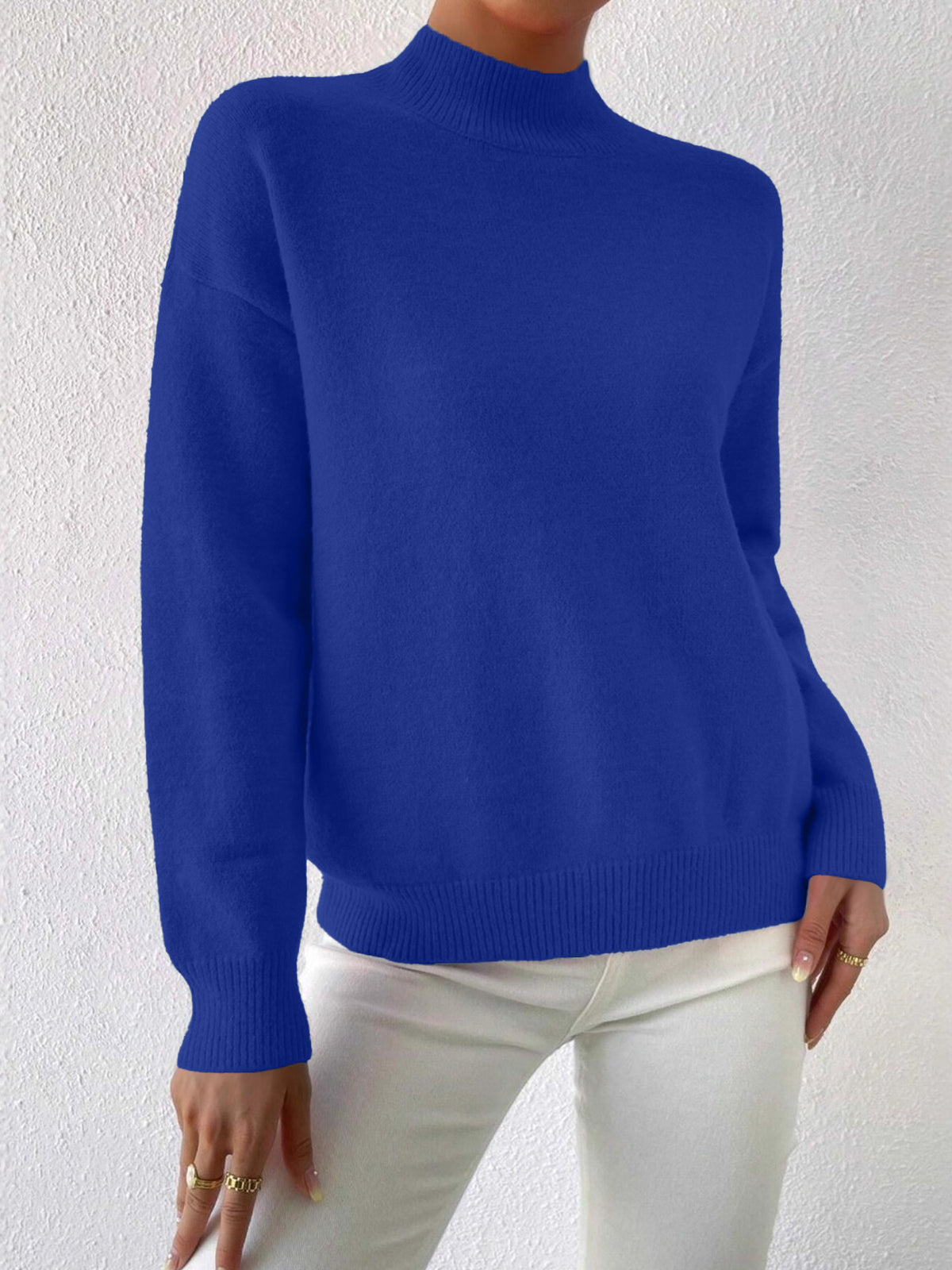 Blue half-high neck pullover sweater with long sleeves worn with white trousers, size S variant image