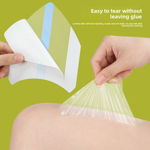 Clear adhesive anti chafing thigh patch smoothed onto an inner thigh with water beading off the surface