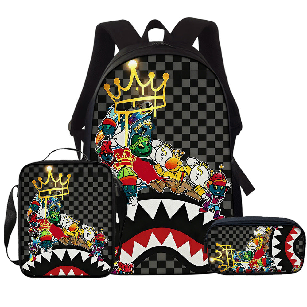 Checker print school backpack with a gold crown, cartoon collage and shark mouth, with matching lunch bag and pencil case