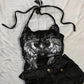 Black halter top with silver wing print and lace shoulders, shown on the Black size L option