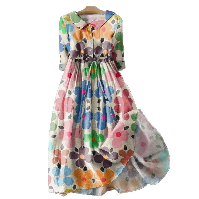 Vintage style floral midi dress with a tie waist and doll collar shown from the front