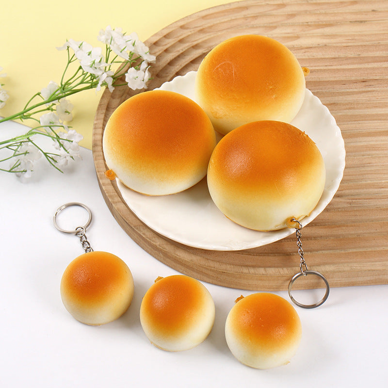 4cm small and 7cm large squishy bread toys shown side by side for size