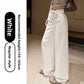 Womens high waist wide leg linen blend drawstring trousers, front view on a model styled with flat sandals