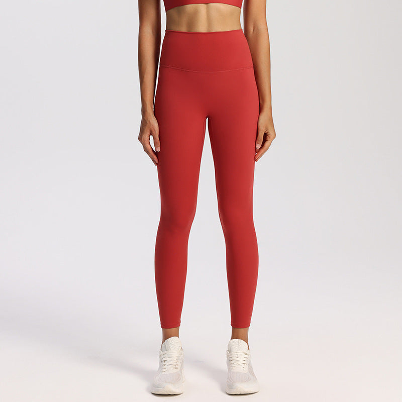High-waisted nylon and spandex yoga leggings for women, shown on a studio model