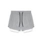 Two in one training shorts in light gray shown flat with the inner liner, with the liner pulled out