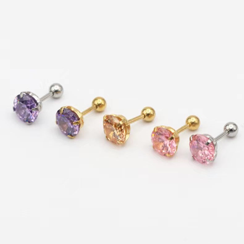 Geometric zircon stud earring worn flush on the lobe in daylight