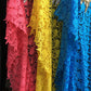 Close view of the openwork guipure lace on the pink and blue kaftans