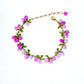 Jade green bead clusters and enamel leaves along a gold tone chain bracelet