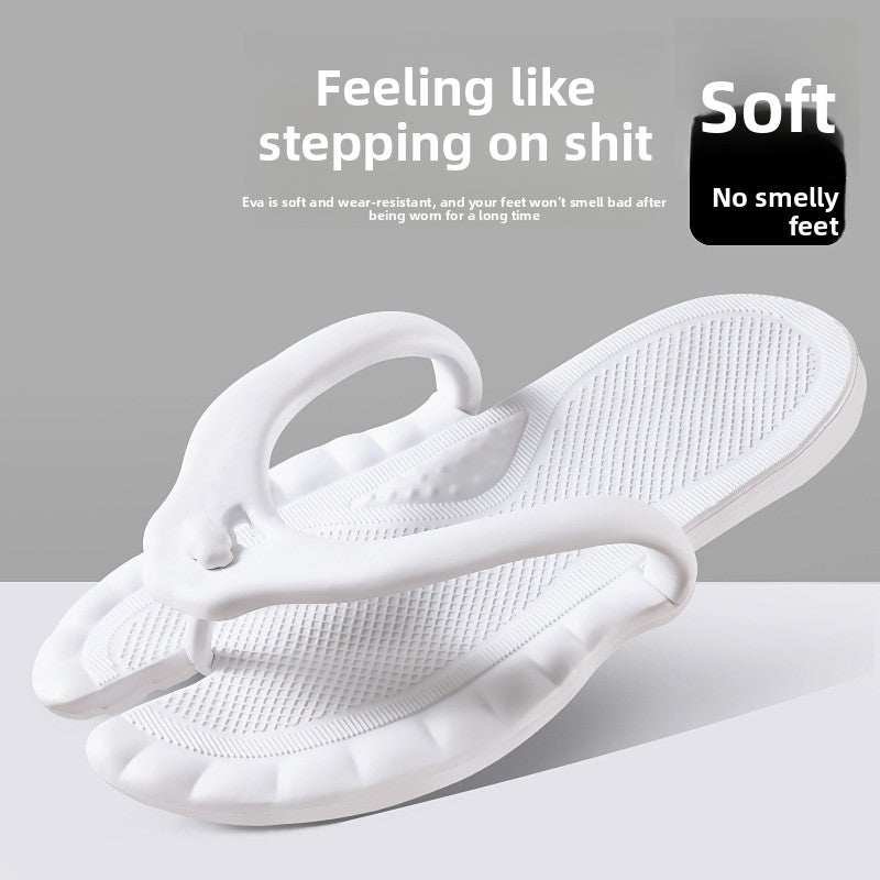 Pair of foldable EVA slippers folded in half at the arch to pack flat for travel