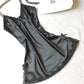 Black satin slip nightdress with black lace trim and small bows, flat on a white cloth, option photo for size XXL