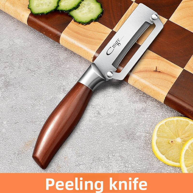 Vegetable peeler with a natural wood handle resting on a surface