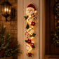 Santa Claus Christmas door hanger glowing on a porch pillar beside a lantern, Santa Claus option