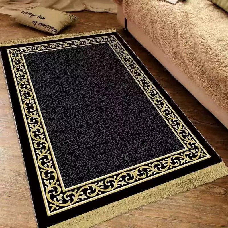 Plush velvet Islamic prayer mat with a printed ornamental design and fringed ends on a wood floor