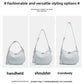Crescent bag shown carried by hand, on the shoulder and crossbody, strap adjustable from 14 to 48 cm