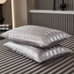 Smooth satin pillowcase with a soft sheen shown on a made bed