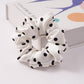 Wide satin band of the scrunchie shown flat