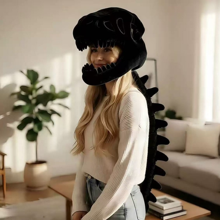 Woman wearing a black plush dinosaur skeleton head mask with a dark spine down her back
