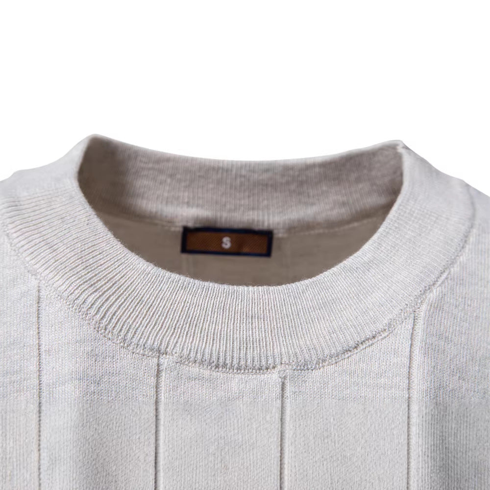 Side view of the cotton knit top showing the short ribbed sleeve and crew neck