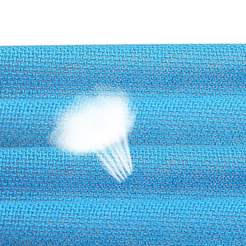 Macro of the blue woven tape surface with a water droplet resting on the weave