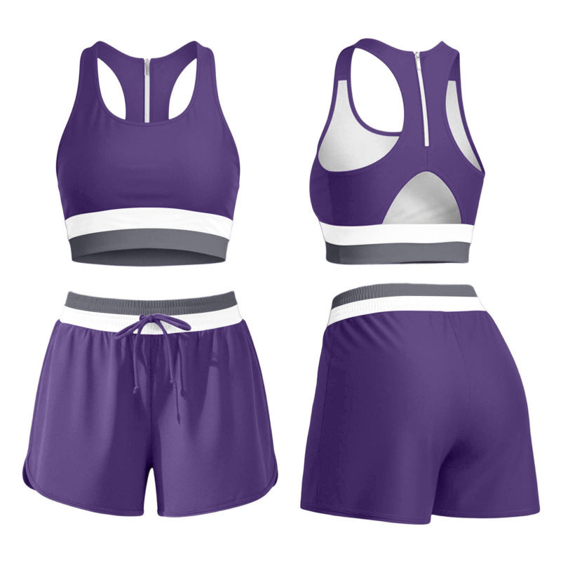 Womens two piece color block swim set worn on the beach, racerback tank top and matching shorts