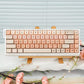 Compact 68 key keyboard with cartoon Kuromi styled accent keys