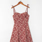 Wine red ditsy floral strap mini dress shown on a wooden hanger