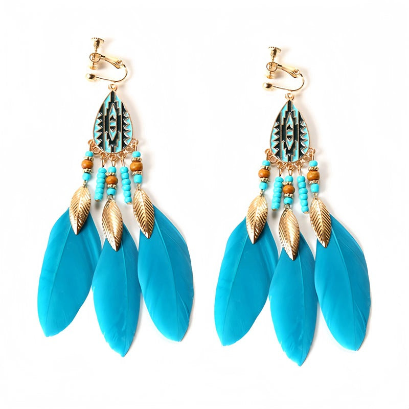 Handmade bohemian clip-on earrings with tassel and bead drop detail, zinc alloy frame, studio shot on white background