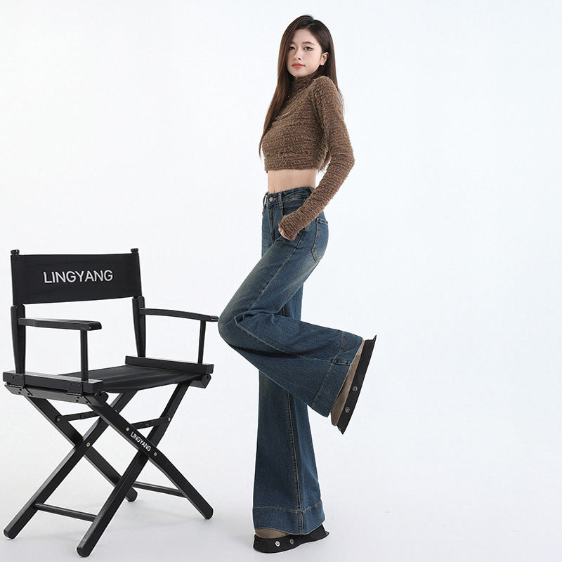 Styled outfit pairing high waist denim flares with a tucked white tee
