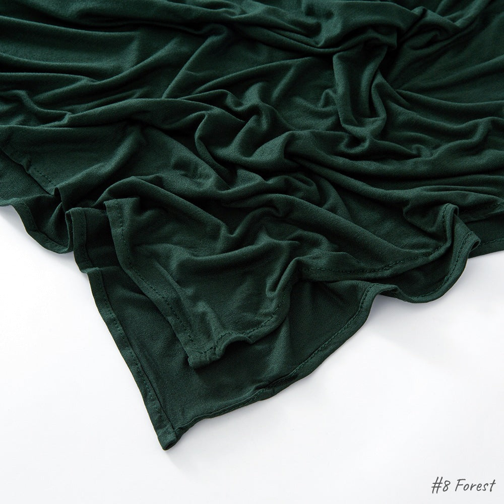 Modal cotton headscarf wrap draped to show length and the smooth fall of the breathable jersey knit