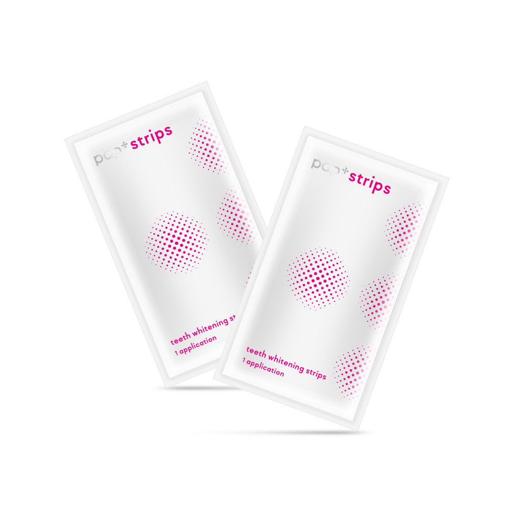 Two individually wrapped PAP+ teeth whitening strips sachets, each labeled 1 application