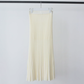 Sweet almond cream ribbed knit skirt with knit waistband hanging on a white hanger