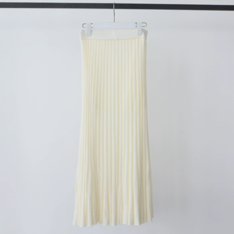 Sweet almond cream ribbed knit skirt with knit waistband hanging on a white hanger