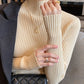 Slim fit vertical rib knit sweater with a semi high collar worn under a coat