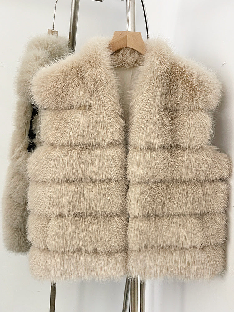 Beige tiered vegan fur sleeveless vest on a wooden hanger with a wide V collar and open front