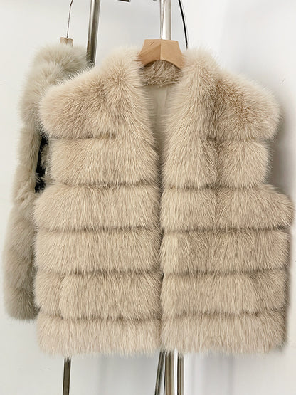 Beige tiered vegan fur sleeveless vest on a wooden hanger with a wide V collar and open front