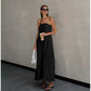 Black cotton linen maxi dress showing long flared skirt and matte fabric