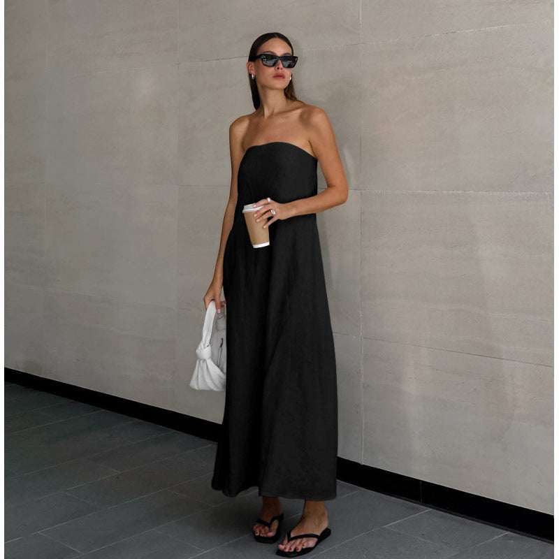 Black cotton linen maxi dress showing long flared skirt and matte fabric