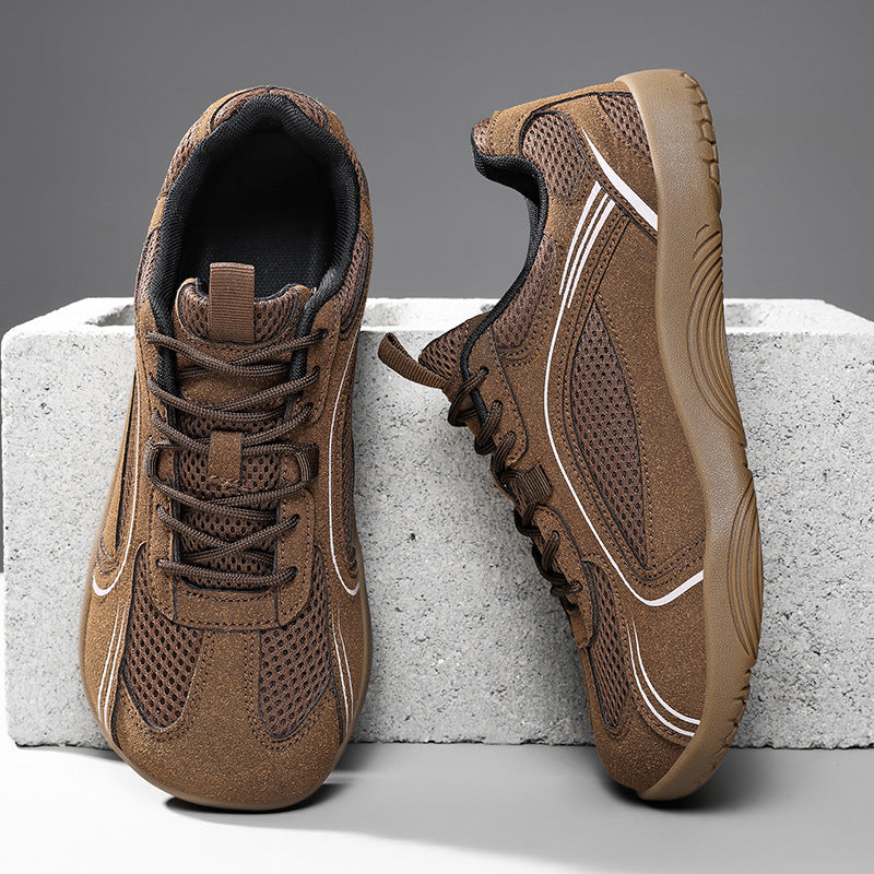 Brown mesh lace-up sneakers with white piping and a gum brown flat sole on a concrete block, size 42 option photo
