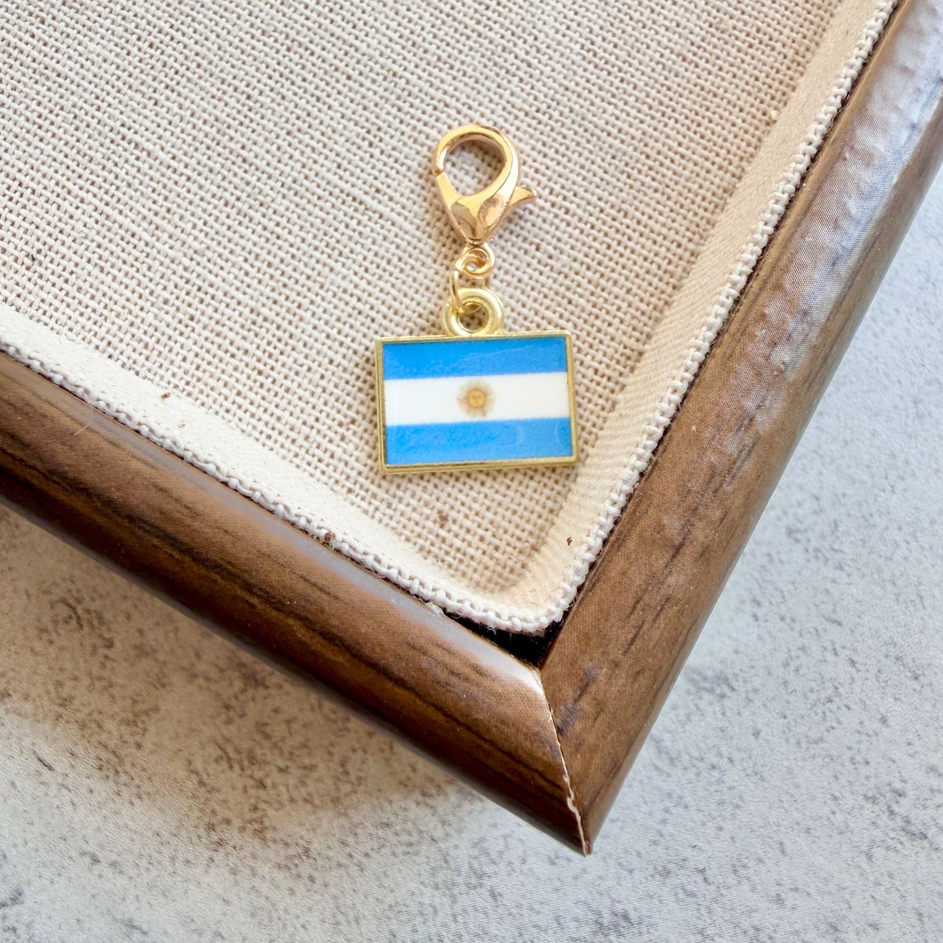 Argentina enamel country flag keychain charm on a gold tone lobster clasp for keys and bags