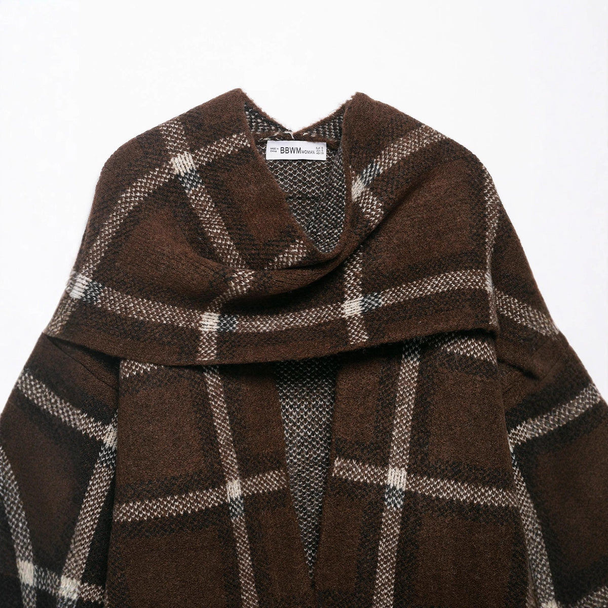 Close-up of the draped scarf collar and BBWM WOMAN neck label on the brown plaid knit cardigan