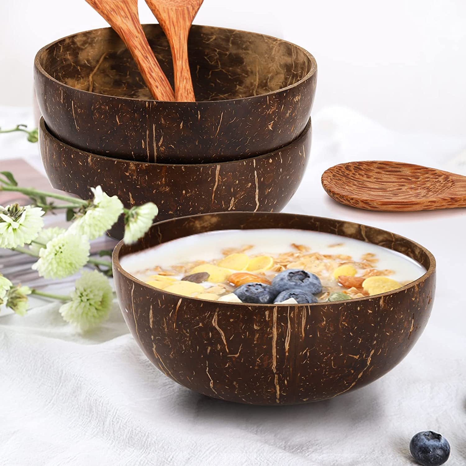 Coconut Shell Bowl with Wood Utensils | side profile detail close up